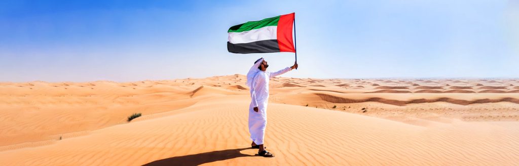 United Arab Emirates flag in the desert of the Emirates